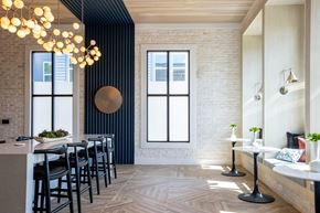 Raleigh apartment for rent - a dining room with black chairs and a long table and a large window