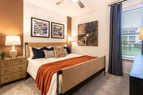 Katy apartment for rent - a bedroom with a bed and a window