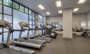 San Francisco apartment for rent - a rendering of a gym with cardio machines and chairs