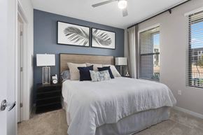 Phoenix apartment for rent - a bedroom with a bed and two windows