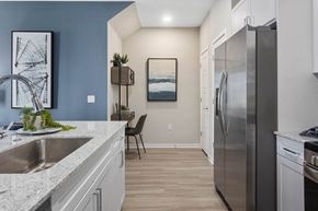 Phoenix apartment for rent - a kitchen with a stainless steel refrigerator and a sink