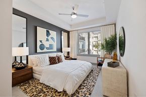 Houston apartment for rent - a bedroom with a bed and a window
