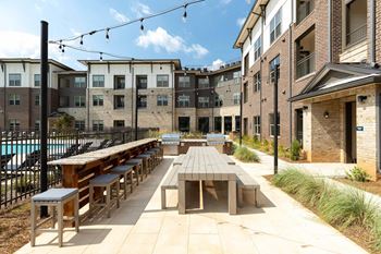 Beer garden with tv, outdoor grilling and dining area