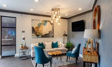 Atlanta apartment for rent - a living room with a couch and a chandelier