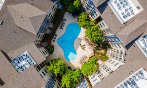 Atlanta apartment for rent - an overhead view of a pool in the middle of an apartment building