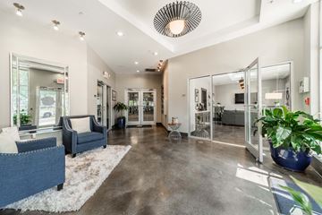 Charlotte apartment for rent - a living room with a couch and a chair in front of a mirror