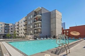 Salt Lake City apartment for rent - a swimming pool with a building in the background
