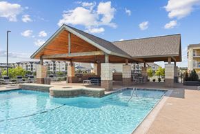 Killeen apartment for rent - a resort style swimming pool with a covered pavilion next to a resortstyle pool