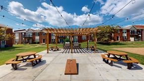 Louisville apartment for rent - a picnic area with benches and a pergola