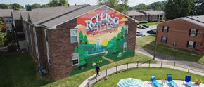 Louisville apartment for rent - a mural is painted on the side of a building