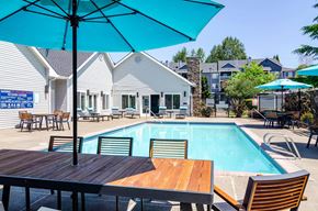 Gresham apartment for rent - Poolside patio with table, chairs and umbrella at The Arden, Gresham