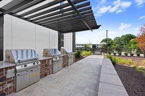 Nashville apartment for rent - the preserve at ballantyne commons outdoor kitchen with stainless steel appliances