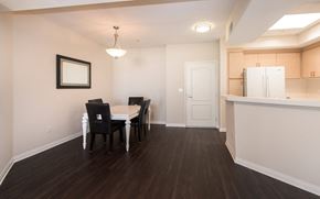 Marina Del Rey apartment for rent - a dining room and kitchen with a table and chairs and a refrigerator