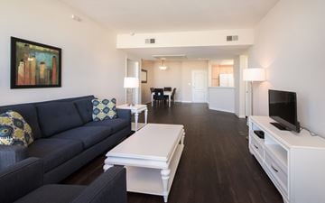 Marina Del Rey apartment for rent - A living room with a blue couch and a white coffee table.