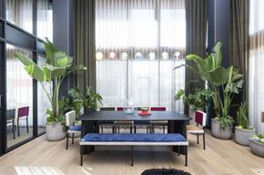 North Hollywood apartment for rent - a dining room with a table and chairs and potted plants