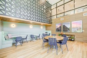 Redmond apartment for rent - A modern dining area with a wooden table and chairs.