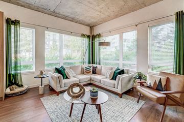 Redmond apartment for rent - A living room with a white couch and green curtains.