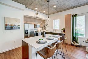 Redmond apartment for rent - an open kitchen and dining room with a table and chairs