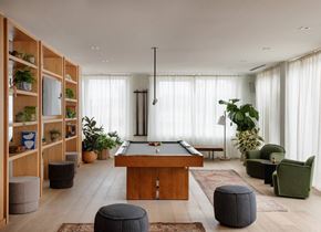 Philadelphia apartment for rent - A room with a pool table and a green chair.
