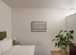 Philadelphia apartment for rent - a bedroom with a bed and a painting on the wall