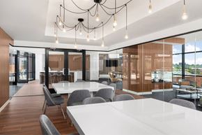 New Rochelle apartment for rent - a large conference room with white tables and chairs