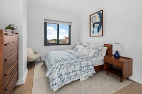New Rochelle apartment for rent - a bedroom with a bed and a window