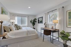 Westminster apartment for rent - A bedroom with a bed, desk, and chair.