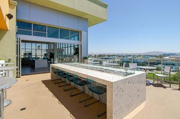 Sky deck with ample seating, firepit and tvs