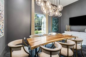Charleston apartment for rent - A dining room with a wooden table and chairs.