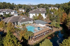 Charleston apartment for rent - A large white building with a pool in front of it.