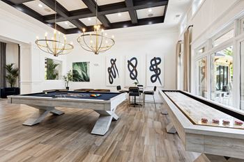 Game room with billiards and shuffleboard
