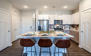 King Of Prussia apartment for rent - A modern kitchen with a dining table set for two.