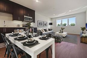 Los Angeles apartment for rent - A modern dining room with a white table set for six.