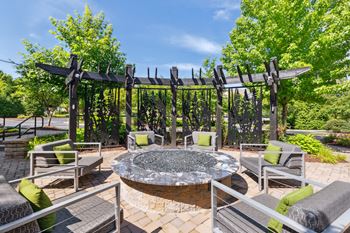 Outdoor lounge with kitchen and fire pit