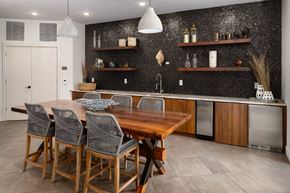 Atlanta apartment for rent - A kitchen with a wooden table and chairs.