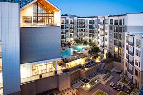 Atlanta apartment for rent - A modern building with a pool in the courtyard.