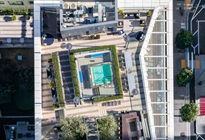 San Francisco apartment for rent - A view of a courtyard with a pool surrounded by buildings.