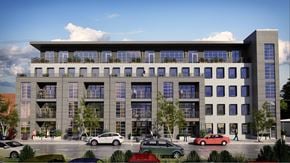 Richmond apartment for rent - A modern building with a parking lot in front.