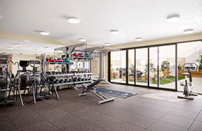 Richmond apartment for rent - A gym with a variety of equipment including treadmills, stationary bikes, and weight machines.