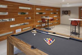 Portland apartment for rent - A pool table with a green cloth and a white cue ball.