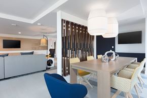 Foster City apartment for rent - A modern dining room with a wooden table and chairs.