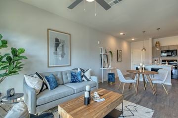 Augusta apartment for rent - A living room with a grey couch and a wooden coffee table.