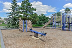 Ann Arbor apartment for rent - A playground with a slide, swings, and a seesaw.