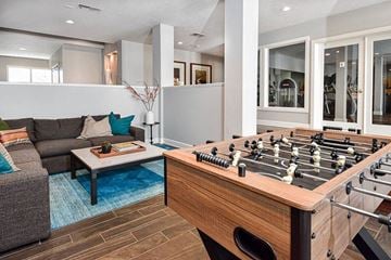 Westerville apartment for rent - A foosball table sits in the middle of a living room.
