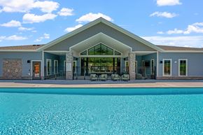 Rochester apartment for rent - Clubhouse and pool view at The Lodge at Overland townhome rentals in Rochester, MN.
