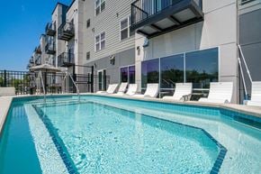 West Saint Paul apartment for rent - Swimming pool with lounge chairs at The Westlyn luxury apartments in St. Paul, MN