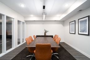 West Saint Paul apartment for rent - A conference room with a long table and orange chairs.