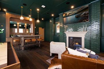 Minneapolis apartment for rent - A cozy living room with a fireplace and a painting on the wall.