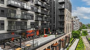 Minneapolis apartment for rent - A modern apartment complex with balconies and a pool.