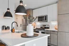 Minneapolis apartment for rent - Brand new kitchen with white countertops at The Bohen apartments in Uptown Minneapolis.